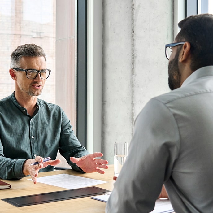 Two colleagues having a discussion at work